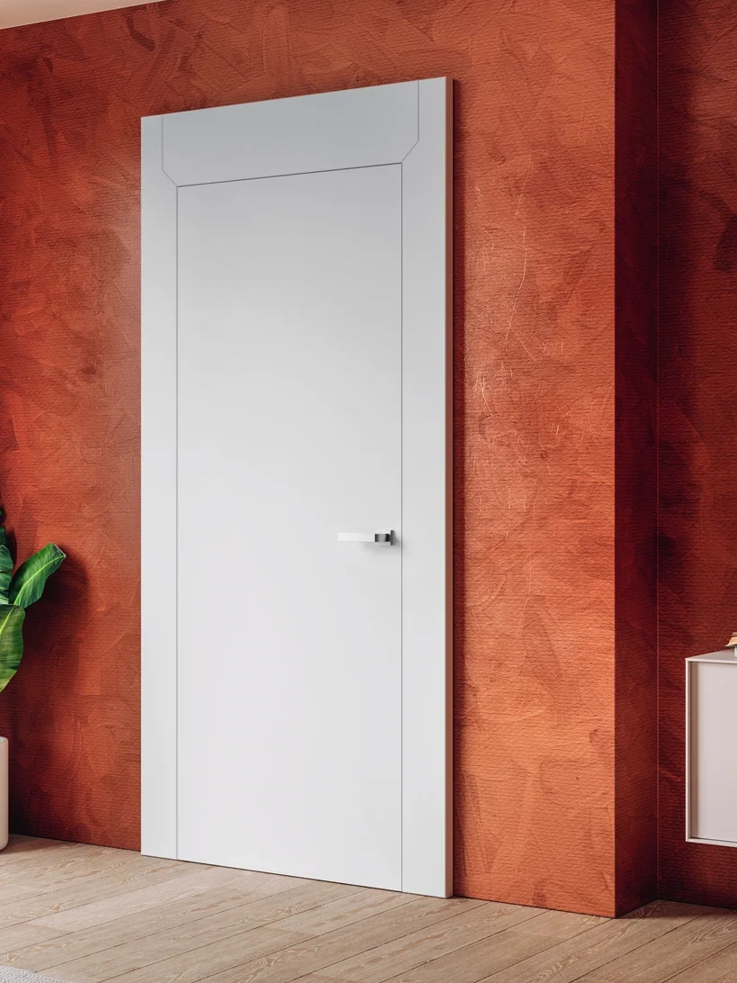 Bertolotto Aurea: white door and broad surround against a terracotta wall